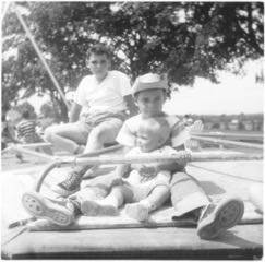 me, nephew Kenny and a friend on merry-g-round, August 1956
